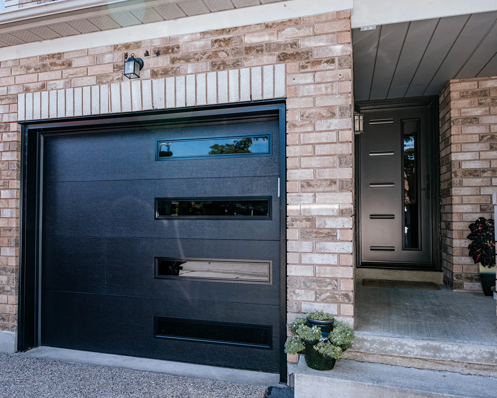 New modern garage door with a sleek design and clean lines, enhancing the exterior of the home.