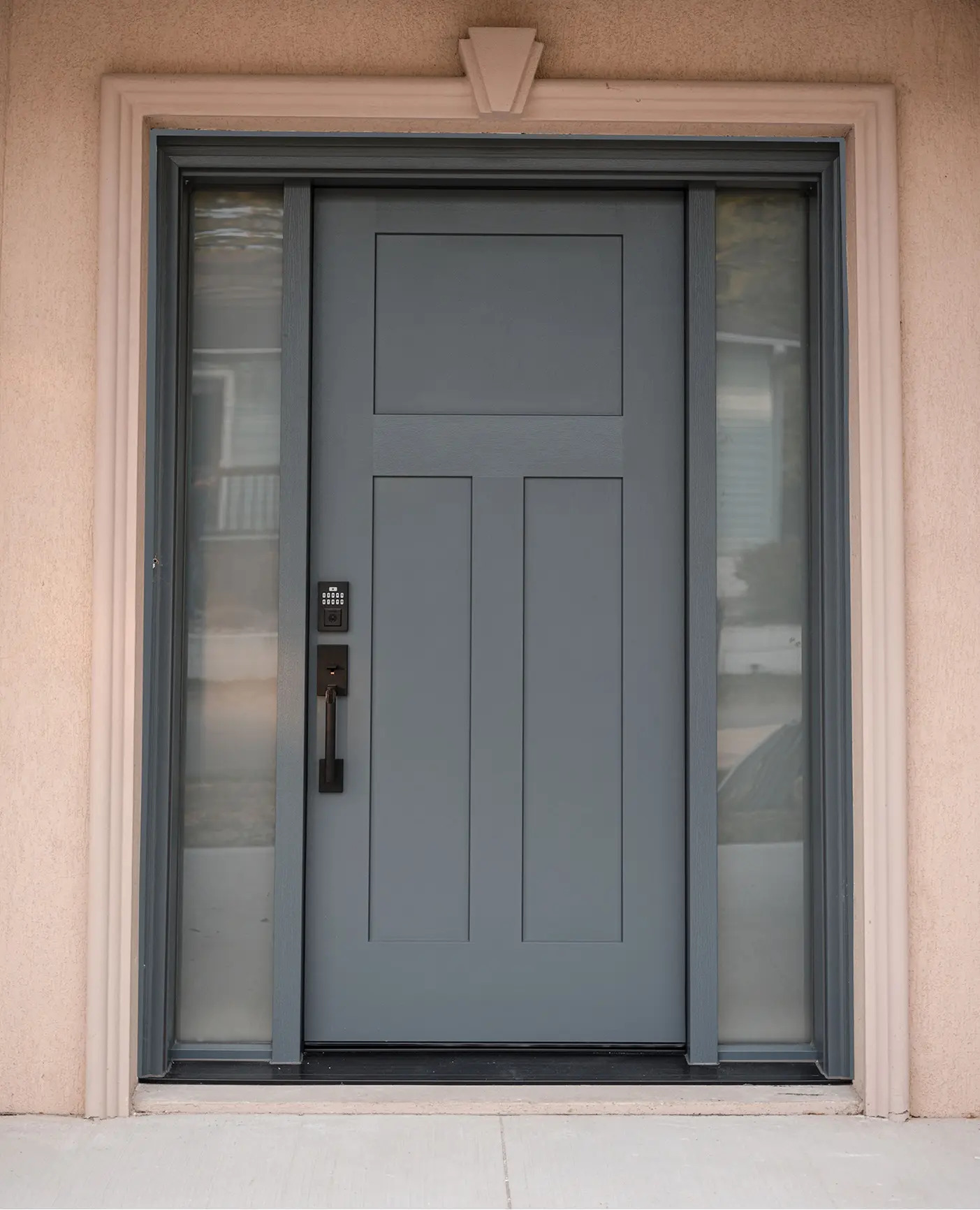 New grey-blue entrance door with minimalist design and digital code lock.