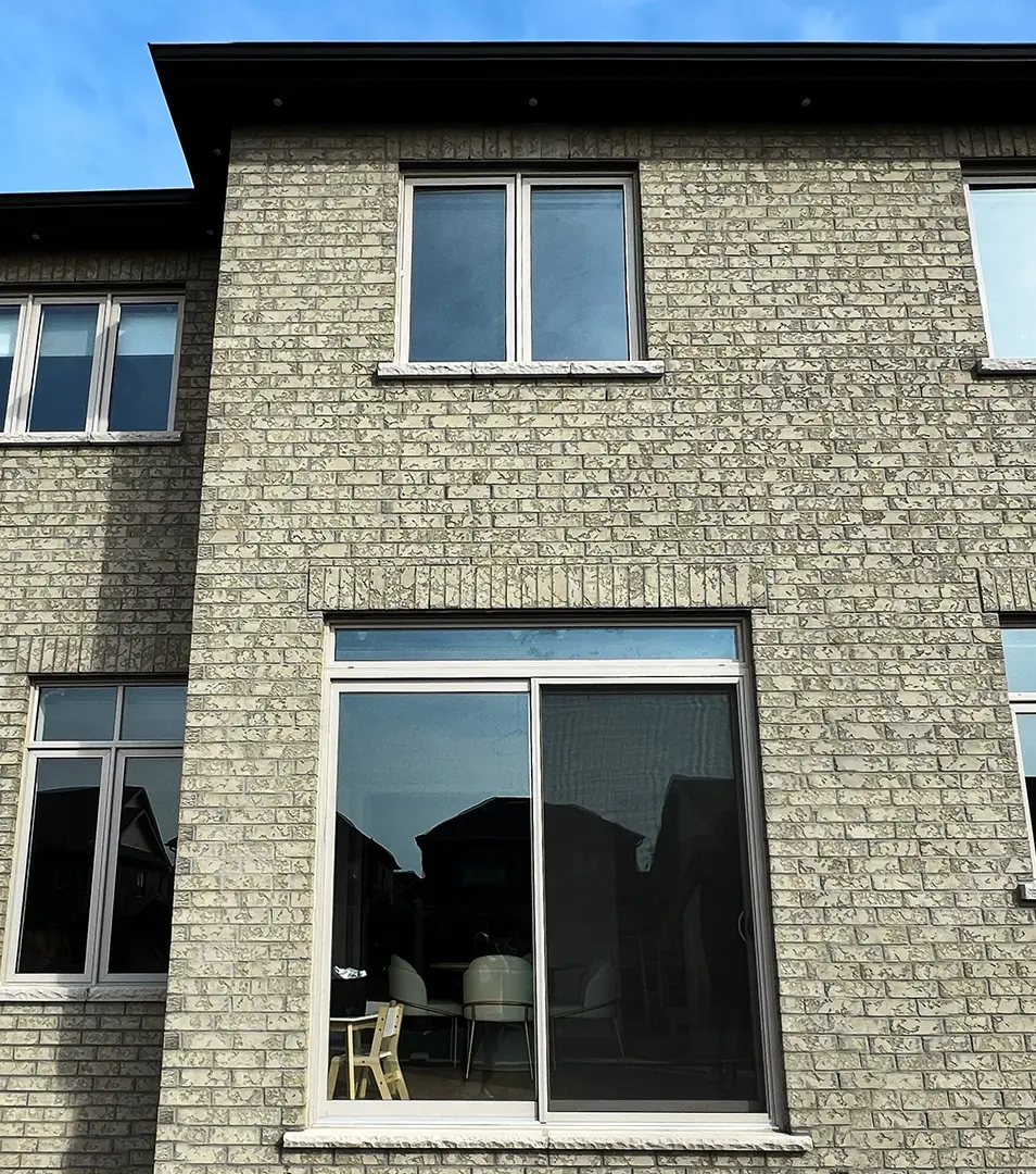 House with outdated white windows