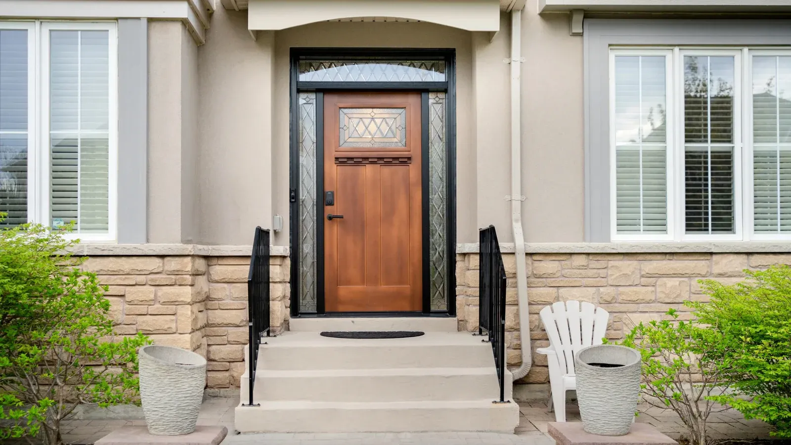Wood-finish craftsman door with leaded glass and sidelites