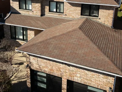 Aerial view of a home with two new black garage doors