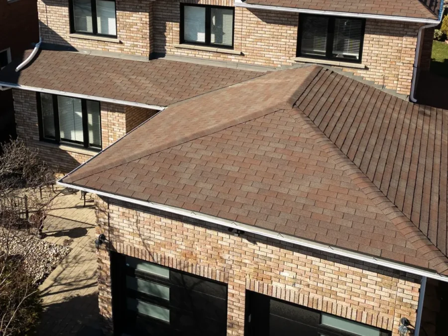Aerial view of a home with two new black garage doors