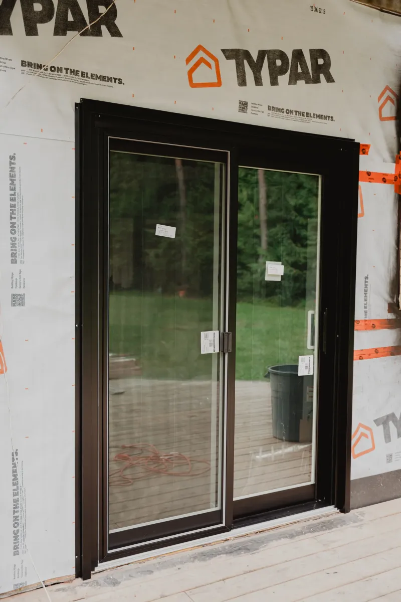 New sliding patio door fitted into a prepared opening