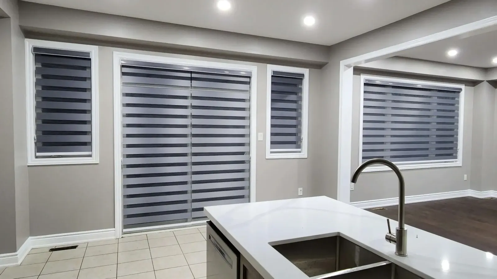 Kitchen windows and patio door fitted with zebra blinds