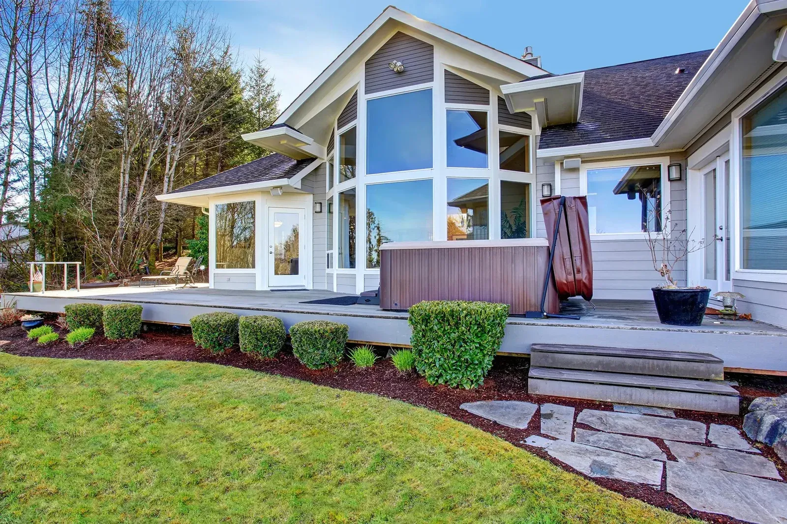 Floor-to-ceiling picture windows on a gabled facade